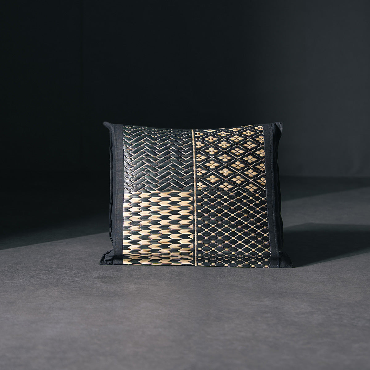 An igusa tatami pillow in black Edo Komon