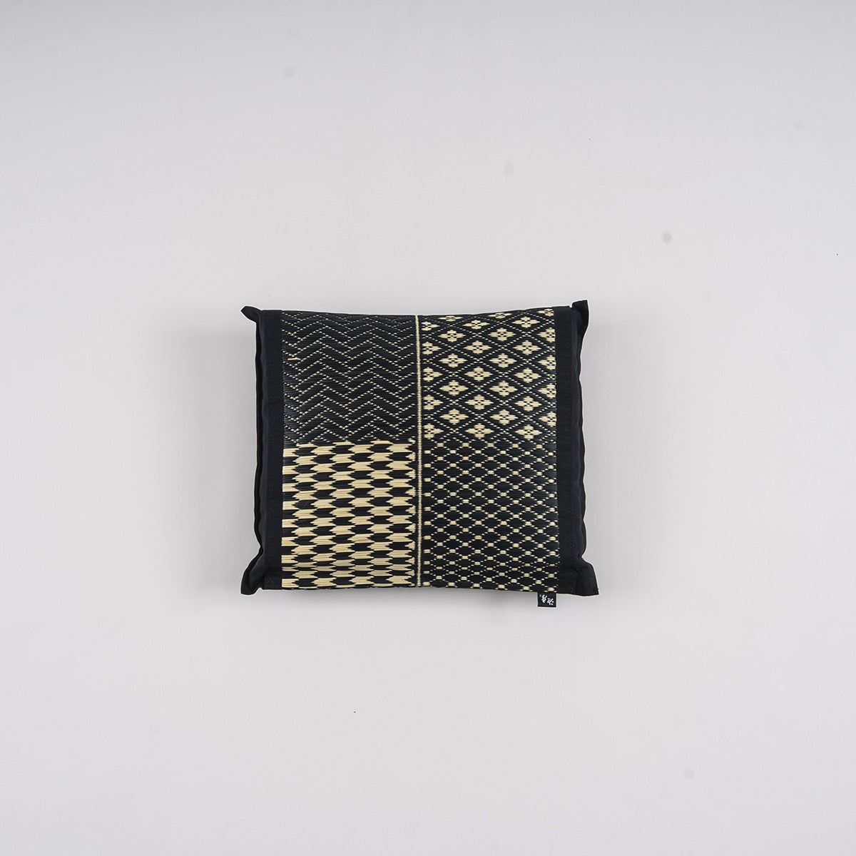 An igusa tatami pillow in black Edo Komon