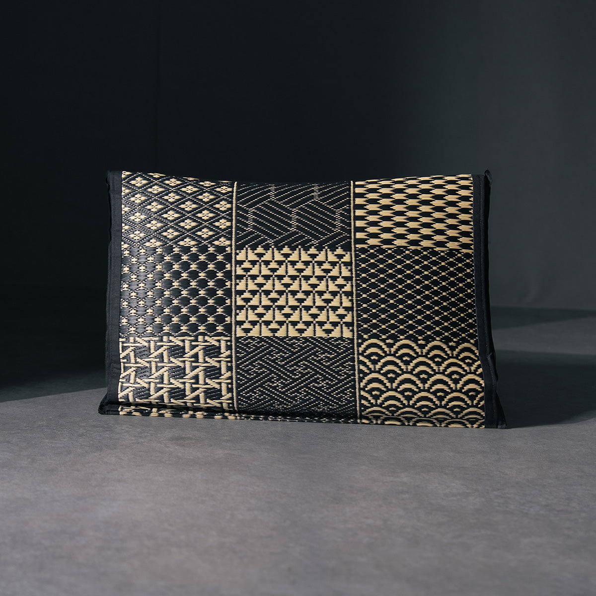An igusa tatami pillow in black Edo Komon 
