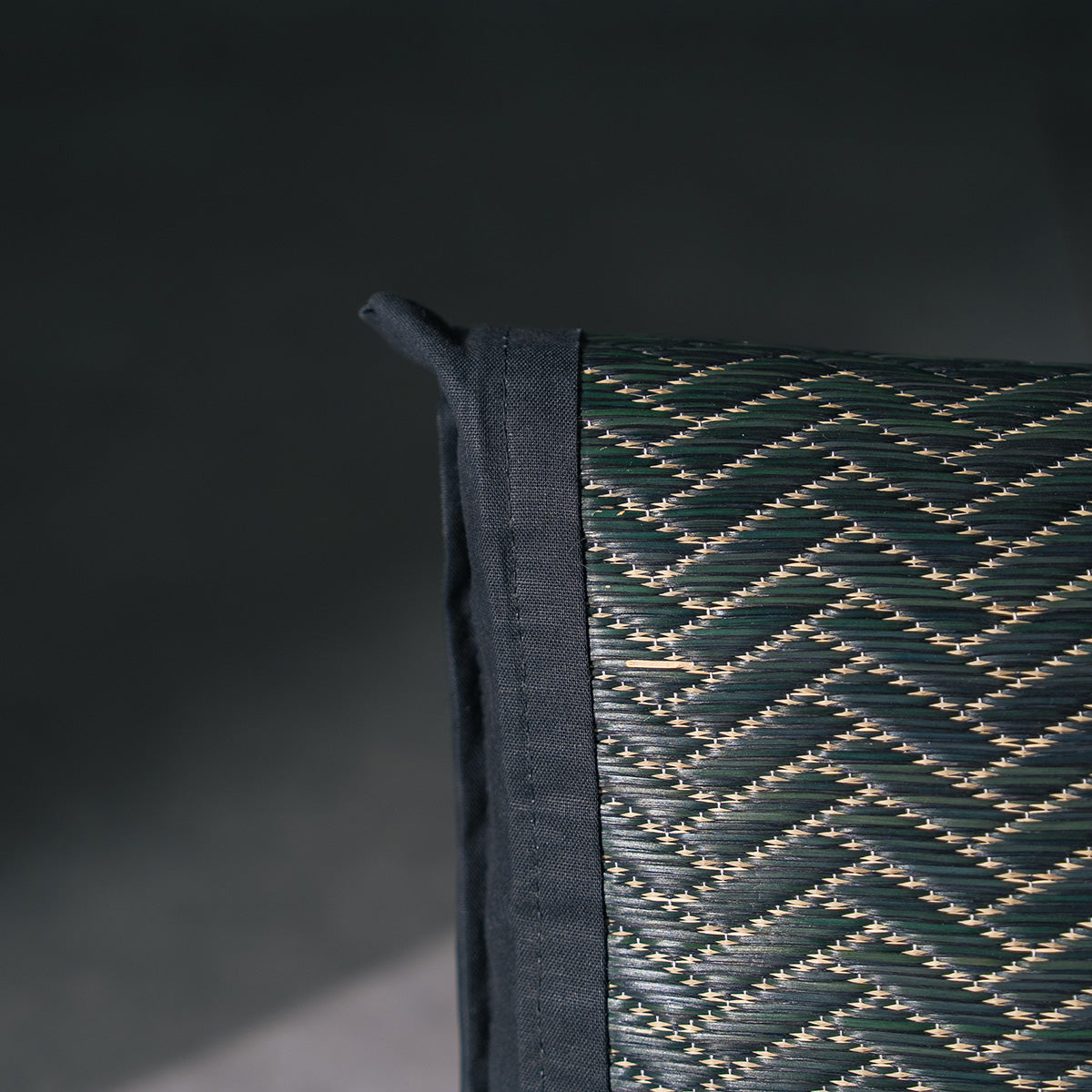 An igusa tatami pillow in black Edo Komon 
