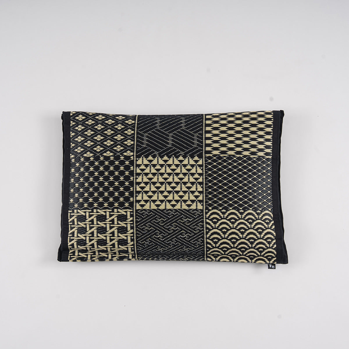 An igusa tatami pillow in black Edo Komon 